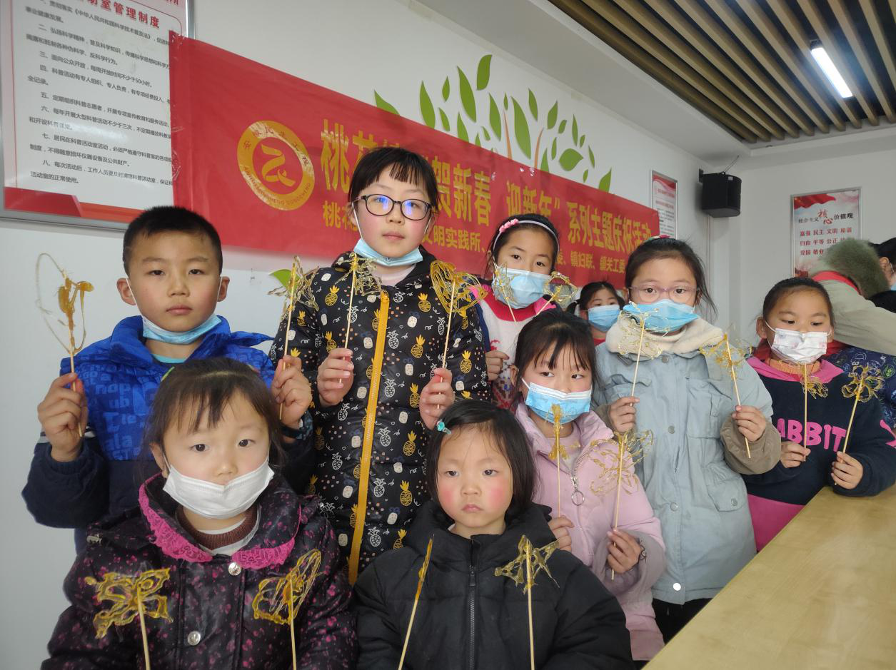 【阳光公益·肥西桃花】“非遗传承——糖画及剪纸教学”新年庆祝活动